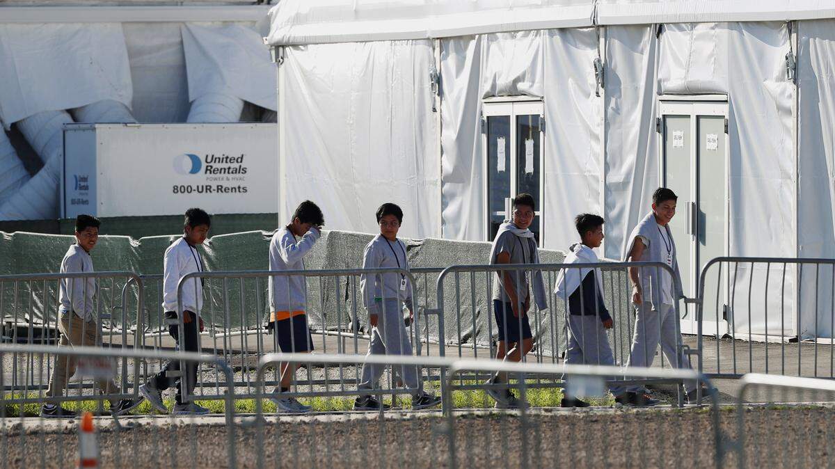 Minors line up to enter a tent at the Homestead Temporary Shelter for Unaccompanied Children in Homestead, Florida, in February 2019.