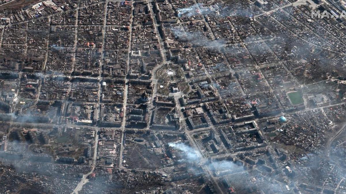 This satellite image provided by Maxar Technologies on Saturday, March 19, 2022 shows the aftermath of the airstrike on the Mariupol Drama theater, center, and the area around it in Mariupol, Ukraine. (Satellite image Â©2022 Maxar Technologies via AP