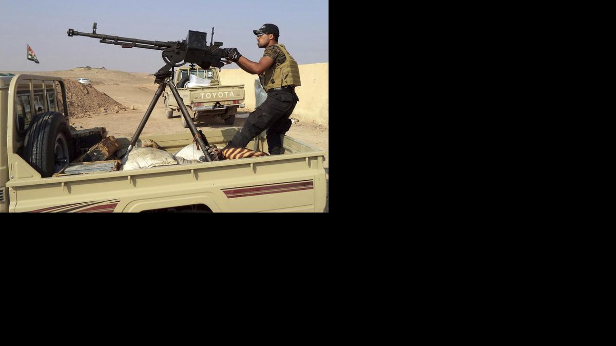<cutline_leadin>Un miembro</cutline_leadin> de la milicia iraquí chiita al-Abbas, que lucha junto a las fuerzas iraquíes para combatir contra el grupo yihadista Estado Islámico (EI) en Irak.