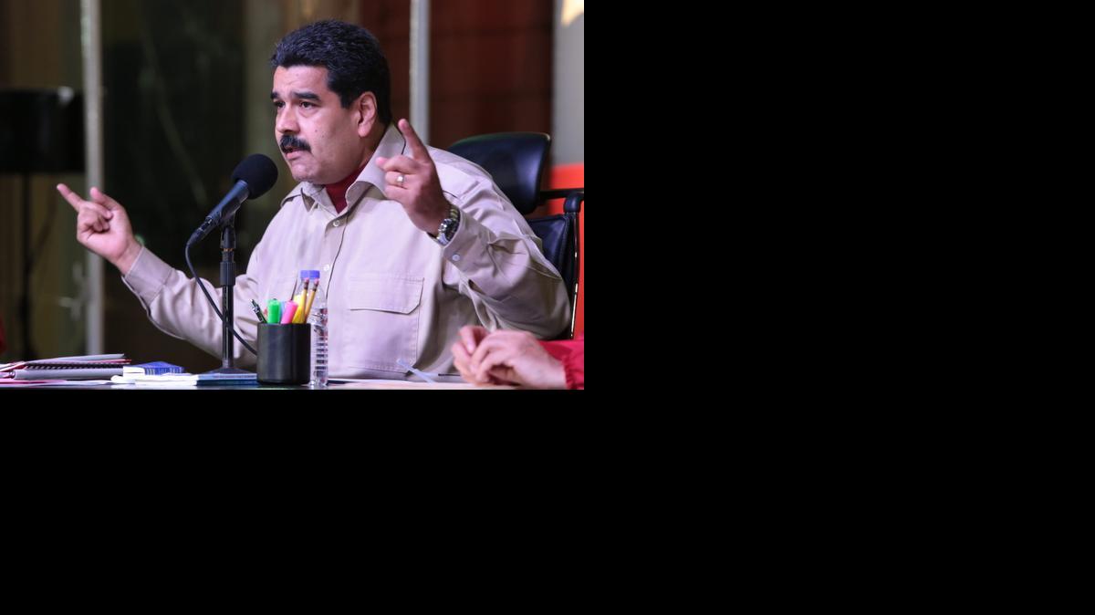 
Fotografía cedida por la Presidencia de Venezuela el viernes 28 de noviembre de 2014, que muestra al mandatario venezolano, Nicolás Maduro, mientras participa en un acto gubernamental, en Caracas (Venezuela).