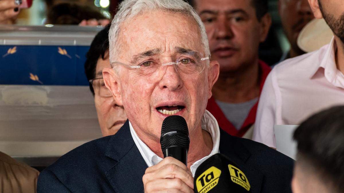 Former Colombian President Alvaro Uribe and supporters attend a mass in Medellin, Colombia, July 27, 2025, one day before the jury’s decision in his trial for witness tampering and fraud.