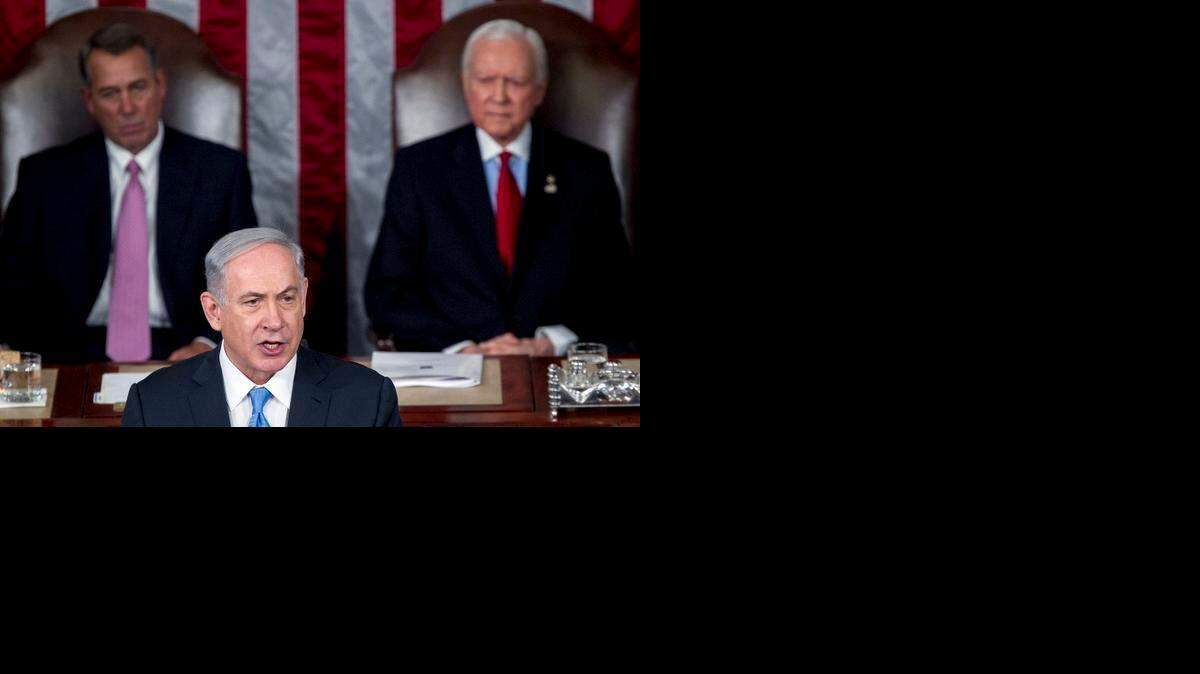 
Benjamin Netanyahu, primer ministro de Israel (centro), habla en una reunión conjunta del Congreso el martes pasado. Detrás, el presidente de la Cámara, John Boehner (izq.), y el senador Orrin Hatch.
