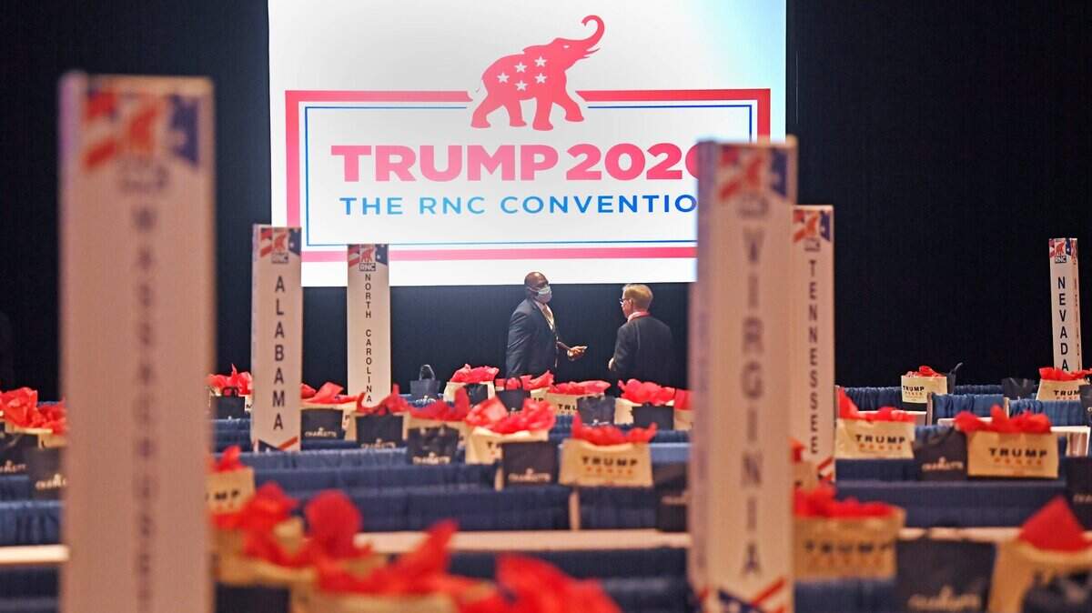 Republican National Convention delegate talk prior to the start of the convention in the Richardson Ballroom at the Charlotte Convention Center in Charlotte, N.C., Monday August, 24, 2020. The GOP convention was scaled back this year because of the coronavirus pandemic. (David T. Foster III/Charlotte Observer/TNS)
