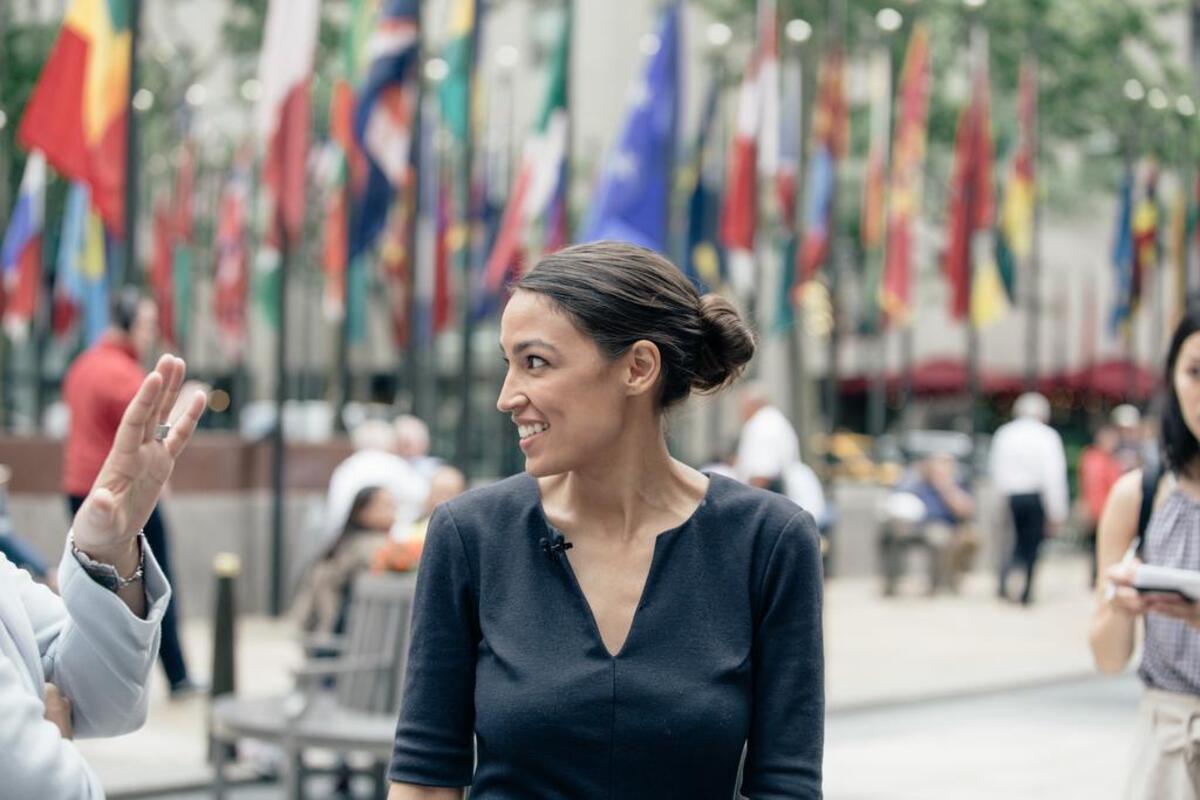 Alexandria Ocasio-Cortez, a young Puerto Rican activist, defeated a 10-term incumbent to become the Democratic nominee for a congressional seat in New York.