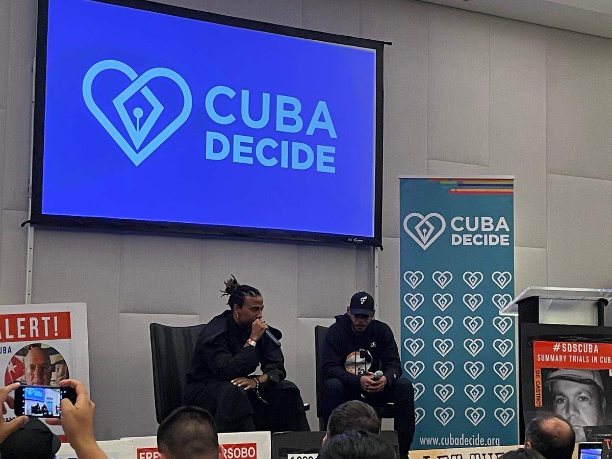 Cuban artists Yotuel Romero and El Funky at an event during the Summit of the Americas in 2022. Both artists performed on the song “Patria y Vida”.