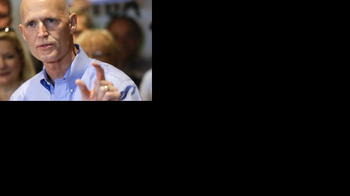 
El gobernador de la Florida, Rick Scott, participa en un acto de campaña  en Winter Park.
