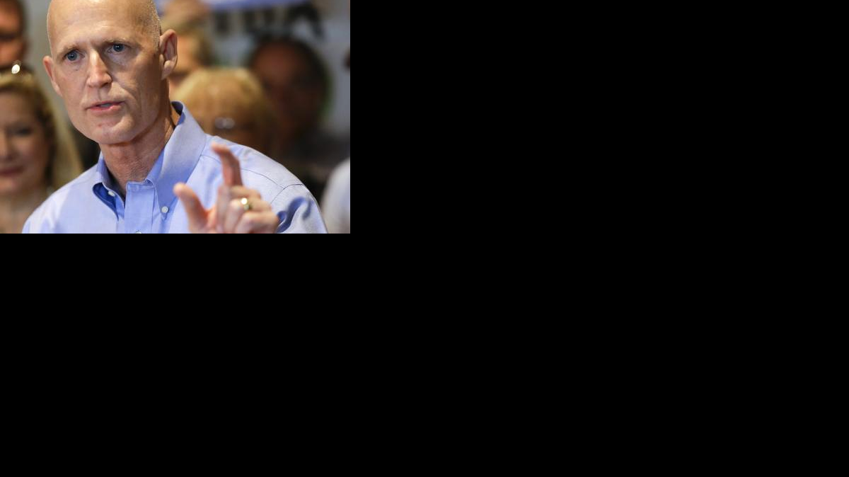 
El gobernador de la Florida, Rick Scott, participa en un acto de campaña  en Winter Park.

