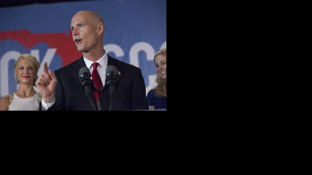 
El gobernador de la Florida, Rick Scott, durante el momento en que anuncia su victoria electoral el 5 de noviembre. 

