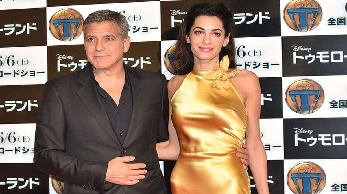 
El actor George Clooney y su esposa, Amal, asisten al estreno de la cinta Tomorrowland en Tokio, el 25 de mayo.
