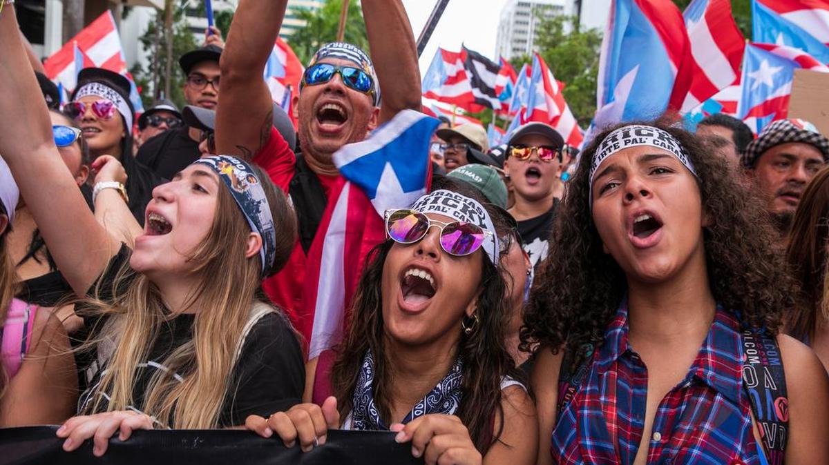 People celebrate the resignation of Gov. Ricardo Rosselló during a march in San Juan, Puerto Rico, on Thursday, July 25, 2019. (Ilana Panich-Linsman/The New York Times)