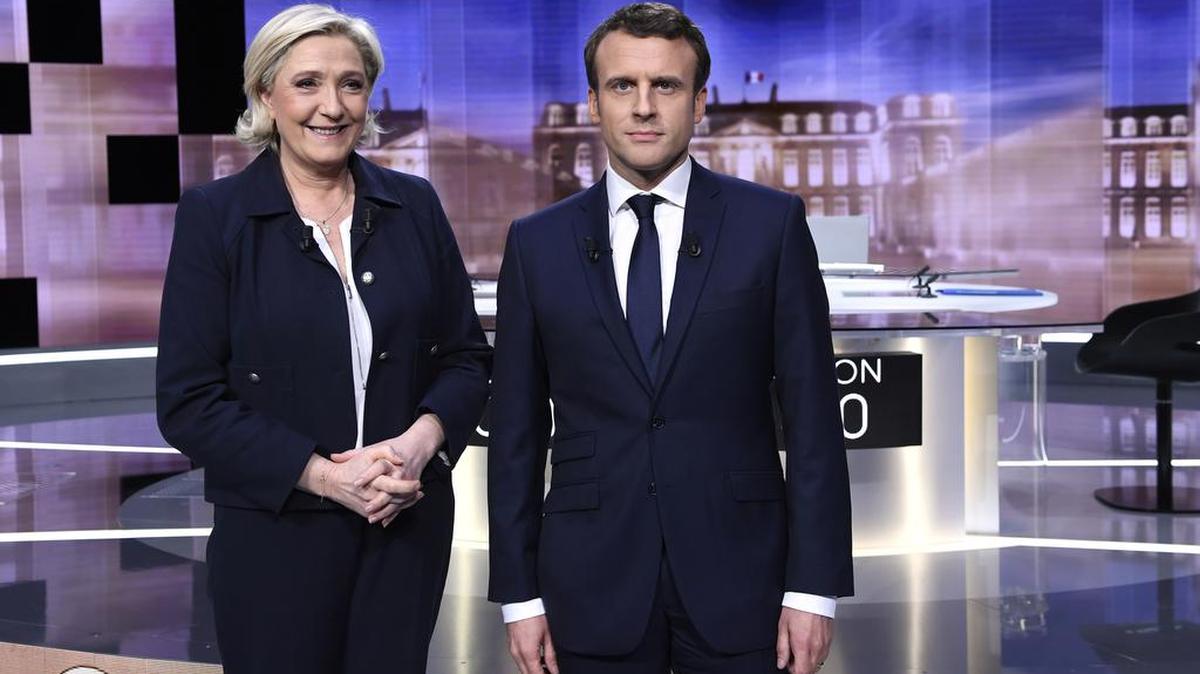 Los candidatos a la presidencia de Francia Marine Le Pen (izq.) y Emmanuel Macron inician un debate televisado el miércoles pasado. La segunda vuelta electoral es el domingo.