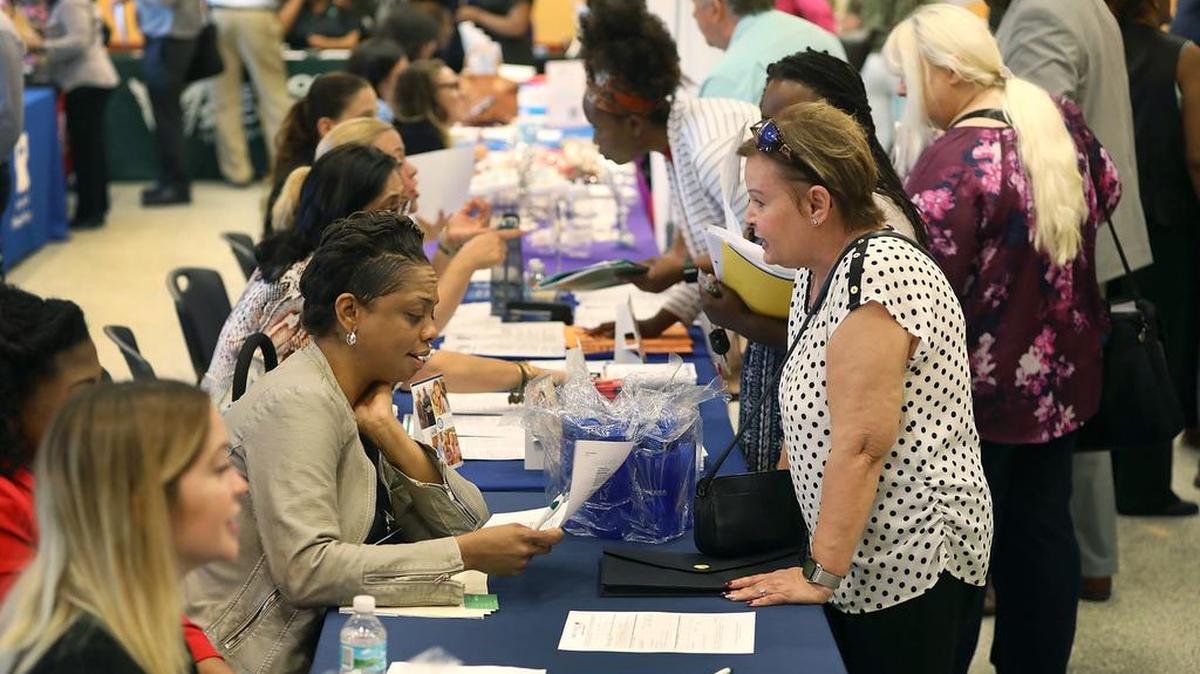 People attend a job fair put on by Miami-Dade County and other sponsors on April 5, 2019, in Miami, Florida. The job fair was being held as the Labor Department released its monthly hiring and unemployment figures for March which showed that 196,000 jobs were added last month, a rebound from the February report. (Photo by Joe Raedle/Getty Images)