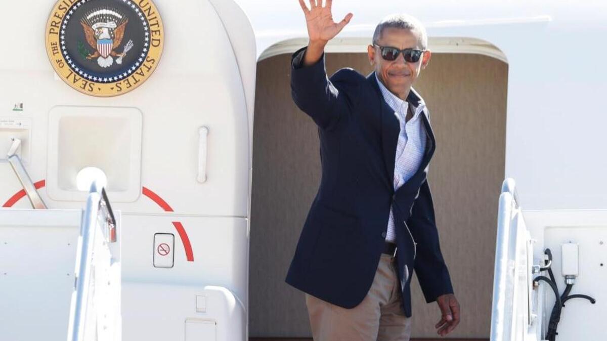 El presidente Barack Obama sube al avión Air Force One en la base aérea de Andrews, en Maryland, el martes pasado. El mandatario se dirigió a Louisiana para evaluar el impacto de las inundaciones.