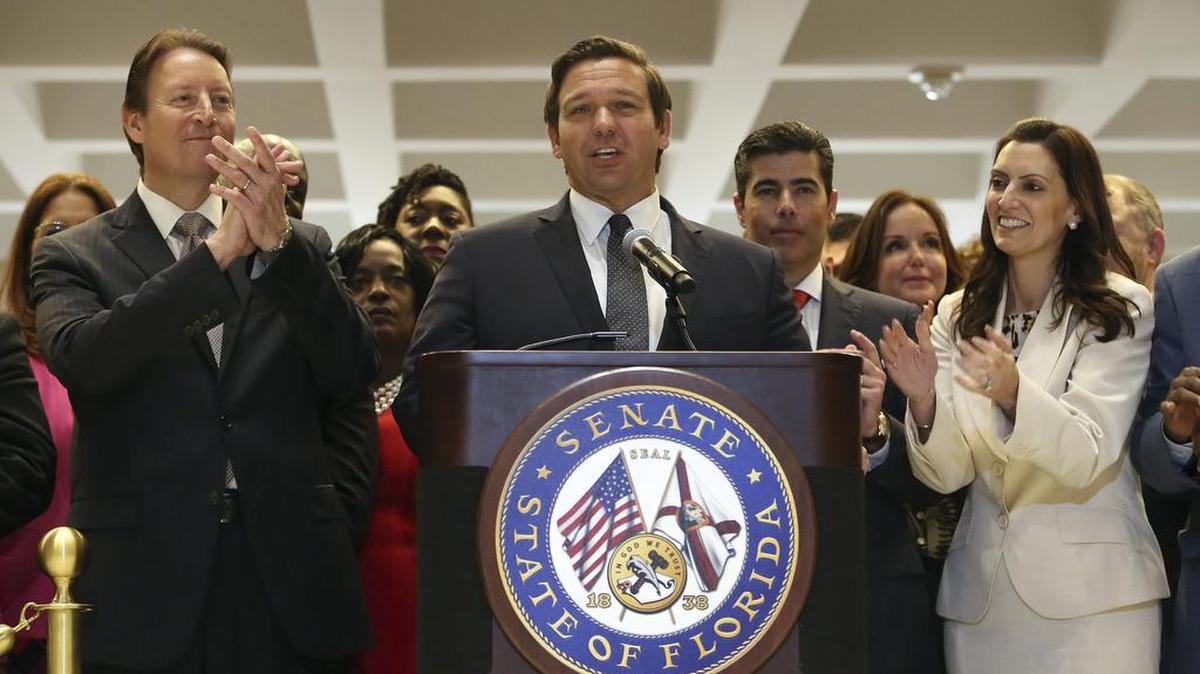 Gov. Ron DeSantis, center, is applauded by Senate President Bill Galvano, R-Bradenton, left, House Speaker Jose Oliva, R-Miami Lakes, center right, and Lt Gov. Jeanette Nuñez, far right, at the end of session Saturday, May 4, 2019, in Tallahassee, Fla.