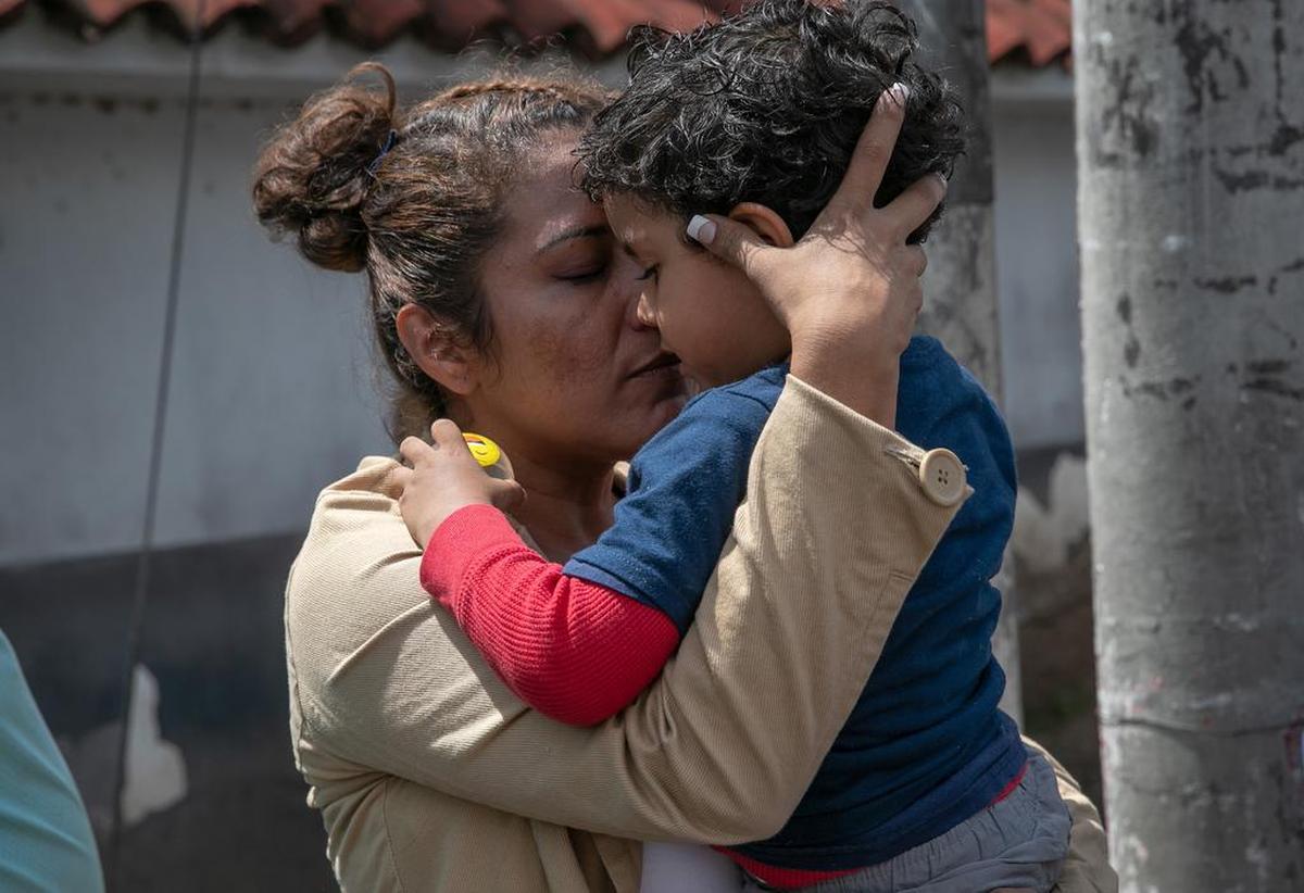 GUATEMALA CITY, GUATEMALA - AUGUST 22: A mother embraces her son after he and his father arrived on an ICE deportation flight from the U.S. on August 22, 2019 in Guatemala City, Guatemala. Under a new policy, ICE has expedited removal procedures for many Guatemalan families and adults arriving to the U.S.-Mexico border. The more streamlined approach replicates how DHS currently works with immigrant removals to Mexico, according to DHS. (Photo by John Moore/Getty Images)