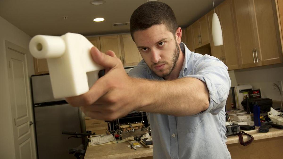 Cody Wilson shows the first completely 3D-printed handgun, The Liberator, at his home in Austin, Texas on Friday May 10, 2013. (Jay Janner/Austin American-State/TNS)