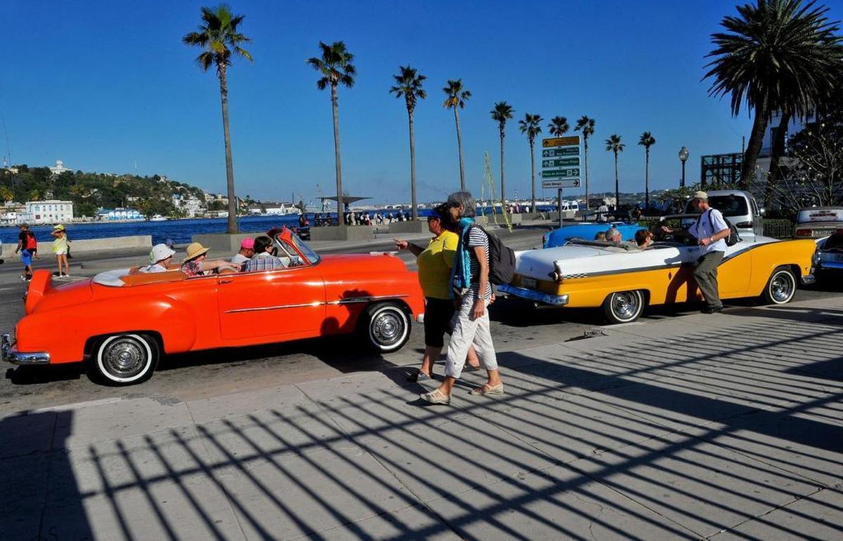 U.S. visitors tour Havana in classic cars in 2015. Since the Trump administration announced new travel rules last fall, the number of Americans visiting the island has fallen off.