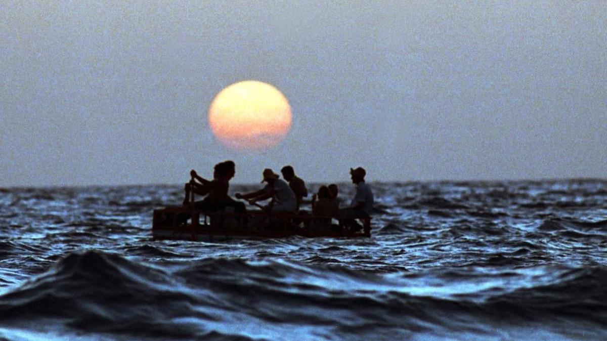 A file photo shows Cubans leaving the island in a makeshift wooden boat during a mass exodus of rafters in this August 1994 file photo. 