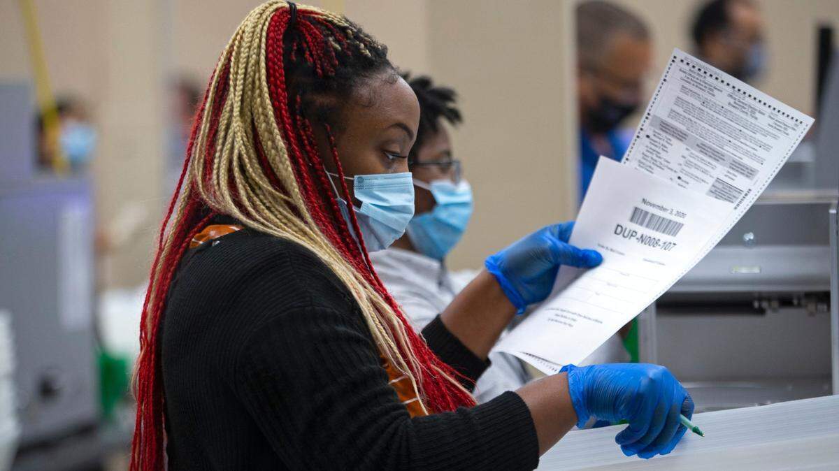 Broward County election department employee counting ballots during the general elections at the Lauderhill Office Supervisor of Elections on Tuesday, November 3, 2020 in Lauderhill.