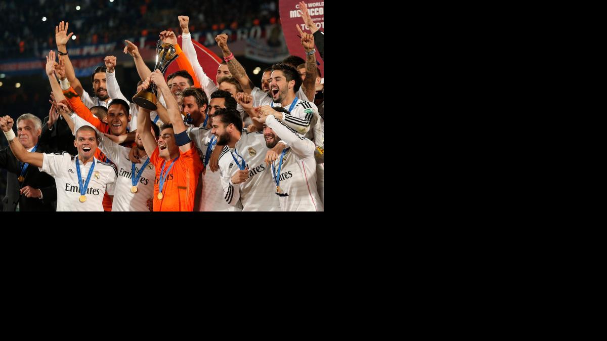 
Real Madrid’s Iker Casillas, centre, lifts the trophy alongside team mates after winning the final soccer match between Real Madrid and San Lorenzo at the Club World Cup soccer tournament in Marrakech, Morocco, Saturday, Dec. 20, 2014. (AP Photo/Christophe Ena)
