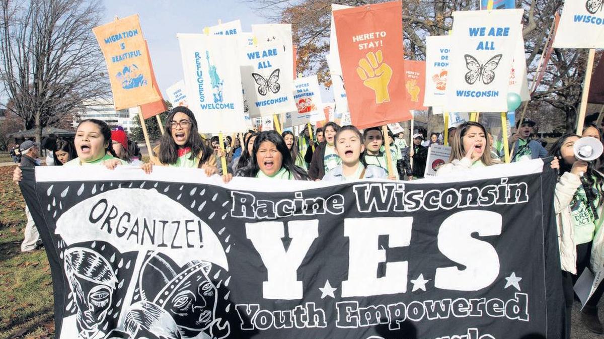 Demonstrators march during an immigration rally in support of the Deferred Action for Childhood Arrivals (DACA), and Temporary Protected Status (TPS), programs, on Capitol Hill in Washington on Dec. 6, 2017.