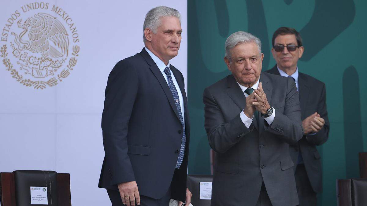 The president of Mexico, Andrés Manuel López Obrador, right, and Cuban leader Miguel Díaz-Canel participate in the celebration of the Independence of Mexico, on Thursday, Sept. 16, 2021, in Mexico City.