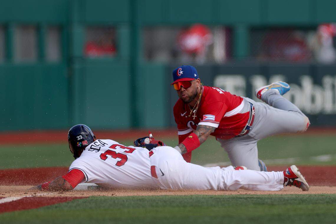 SAN JUAN, PUERTO RICO - MARCH 06: Edmundo Sosa #33 of the Team Panama is out at third base as Yoán Moncada #10 of the Team Cuba applies the tag during the eighth inning at Hiram Bithorn Stadium on March 06, 2026 in San Juan, Puerto Rico. (Photo by Al Bello/Getty Images)