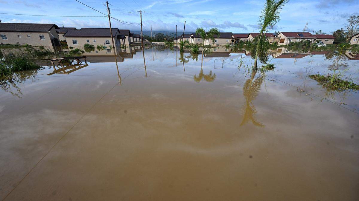 Flooded homes are seen after the passage of Hurricane Melissa in Howard Acres neighbourhood in St. Elizabeth, Jamaica on October 29, 2025. Hurricane Melissa ripped up trees and knocked out power after making landfall in Jamaica on October 28, 2025 as one of the most powerful hurricanes on record, inundating the island nation with rains that threaten flash floods and landslides. (Photo by Ricardo MAKYN / AFP) (Photo by RICARDO MAKYN/AFP via Getty Images)