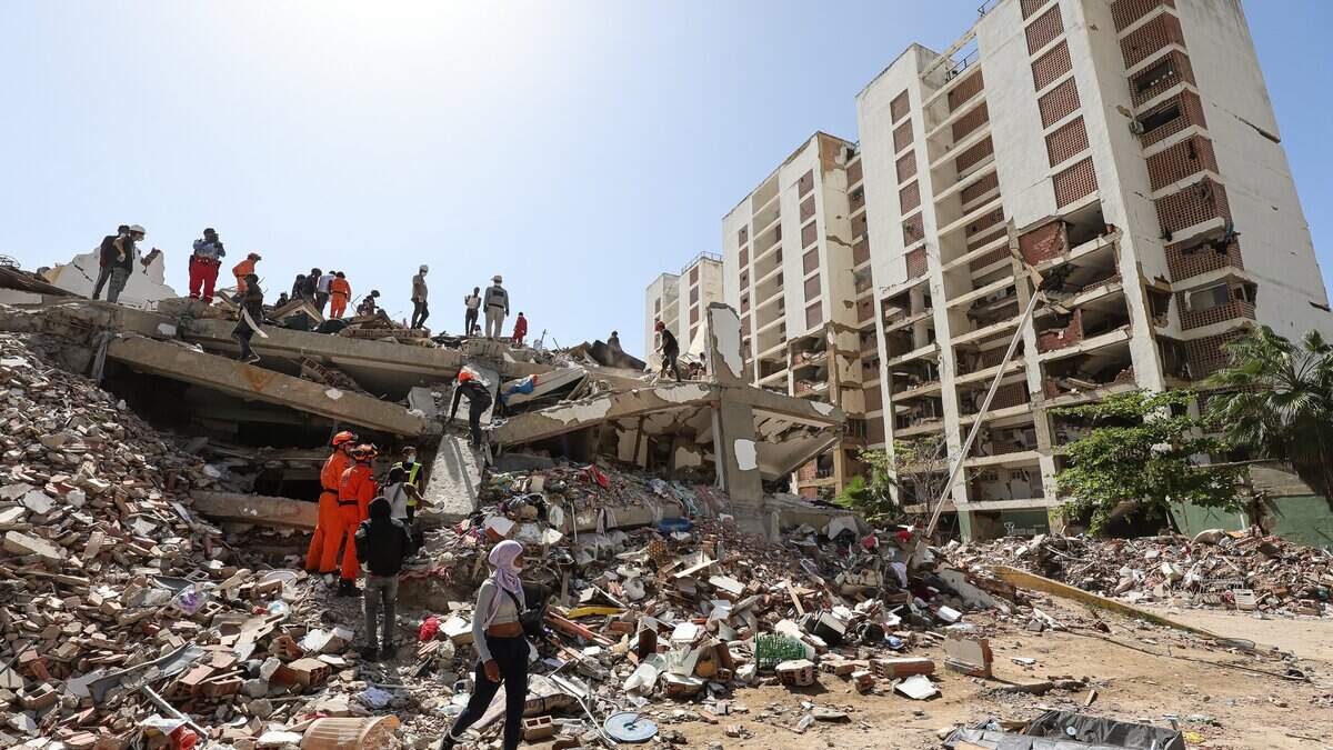 CARABALLEDA, VENEZUELA - JULY 1: Rescuers continue the search for victims under the ruins of a building after a magnitude 7.2 earthquake struck Venezuela and other regions in the Caribbean on July 1, 2026 in Caraballeda, La Guaira, Venezuela. According to the U.S. Geological Survey (USGS), the main earthquake on June 24, 2026 was followed by a 7.5-magnitude aftershock less than a minute later. The number of fatal victims increased to 2295, while the number of injured people exceeded 10,000. More than 70,000 people are reported missing. (Photo by Jesus Vargas/Getty Images)