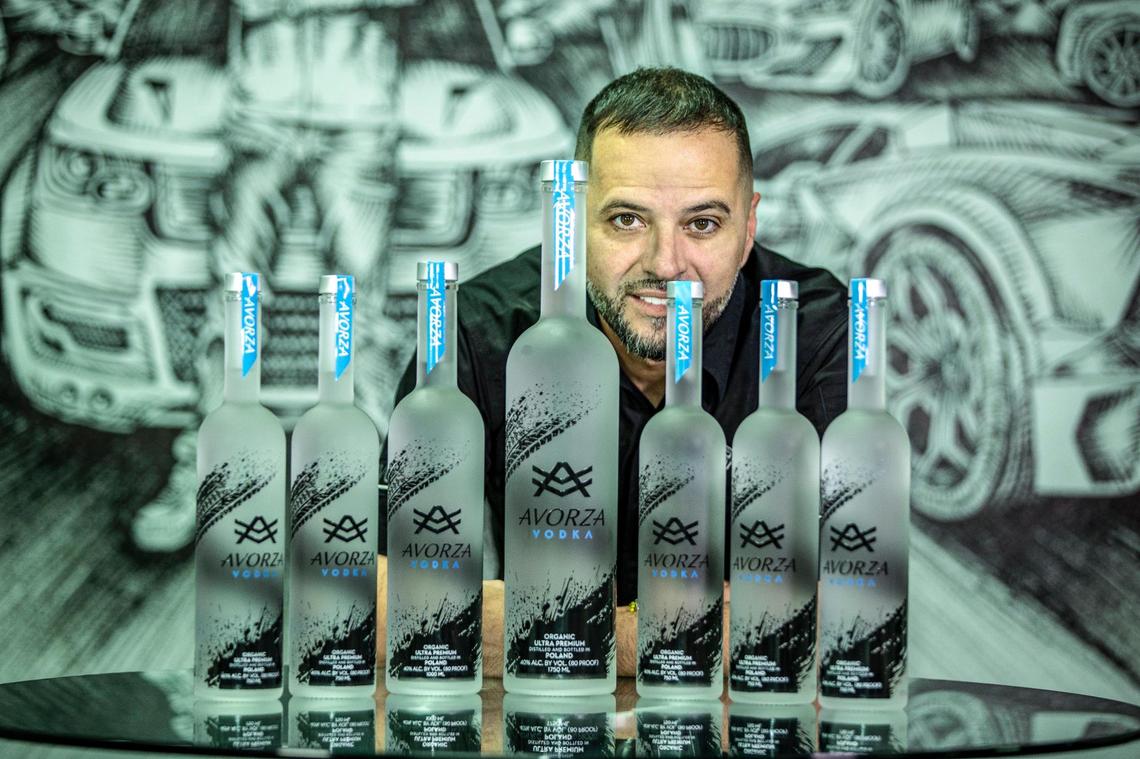 Alex Vega, owner of the Auto Firm, displays a set of Avorza Vodka bottles on Friday March 11, 2022,