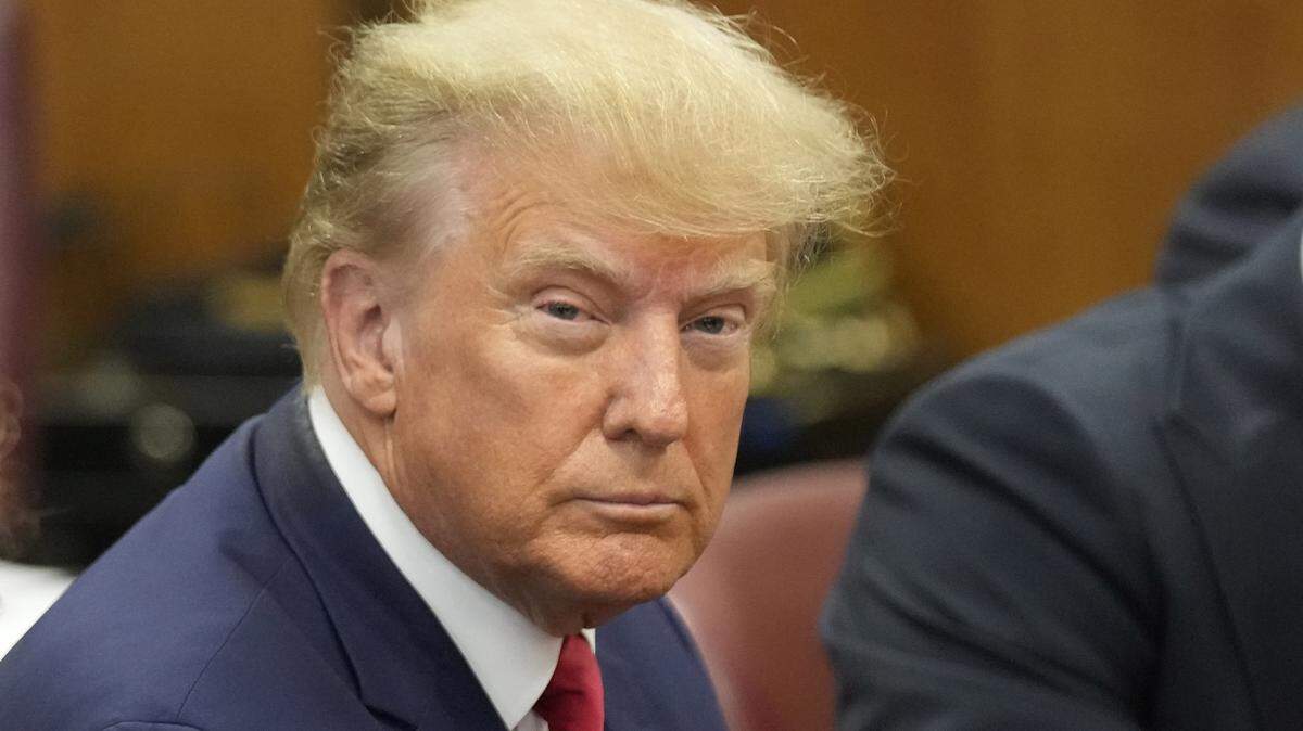 Former President Donald Trump appears in a Manhattan courtroom on state charges of paying hush money to a porn actress in April 2023.
