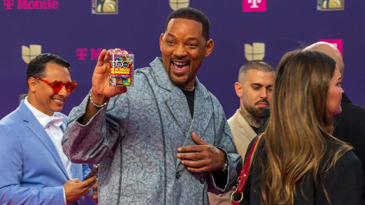 Will Smith reacts as he arrives on the magenta carpet at the Premio Lo Nuestro 2025, held at the Kaseya Center, in Miami, Thursday, February 20, 2025.