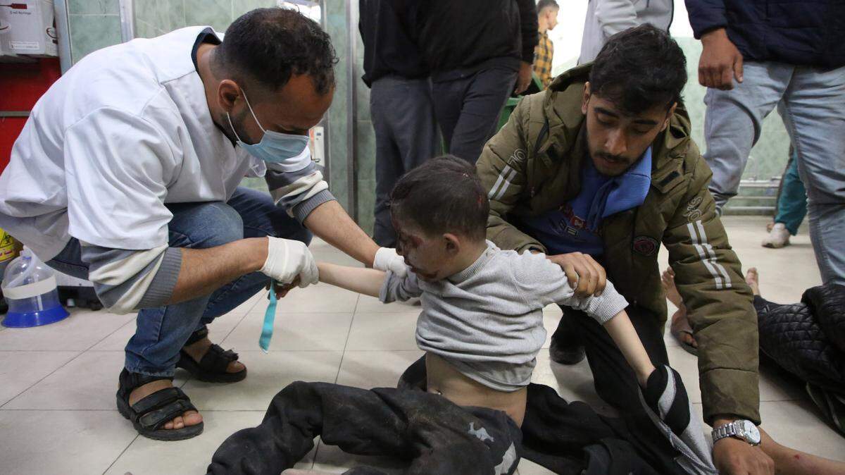 (240325) -- RAFAH, March 25, 2024 (Xinhua) -- A child receives treatment at a local hospital in the southern Gaza Strip city of Rafah, on March 24, 2024. The Palestinian death toll in the Gaza Strip from ongoing Israeli attacks has risen to 32,333, the Hamas-run Health Ministry said in a press statement on Monday. (Photo by Khaled Omar/Xinhua) (Photo by Xinhua/Sipa USA)