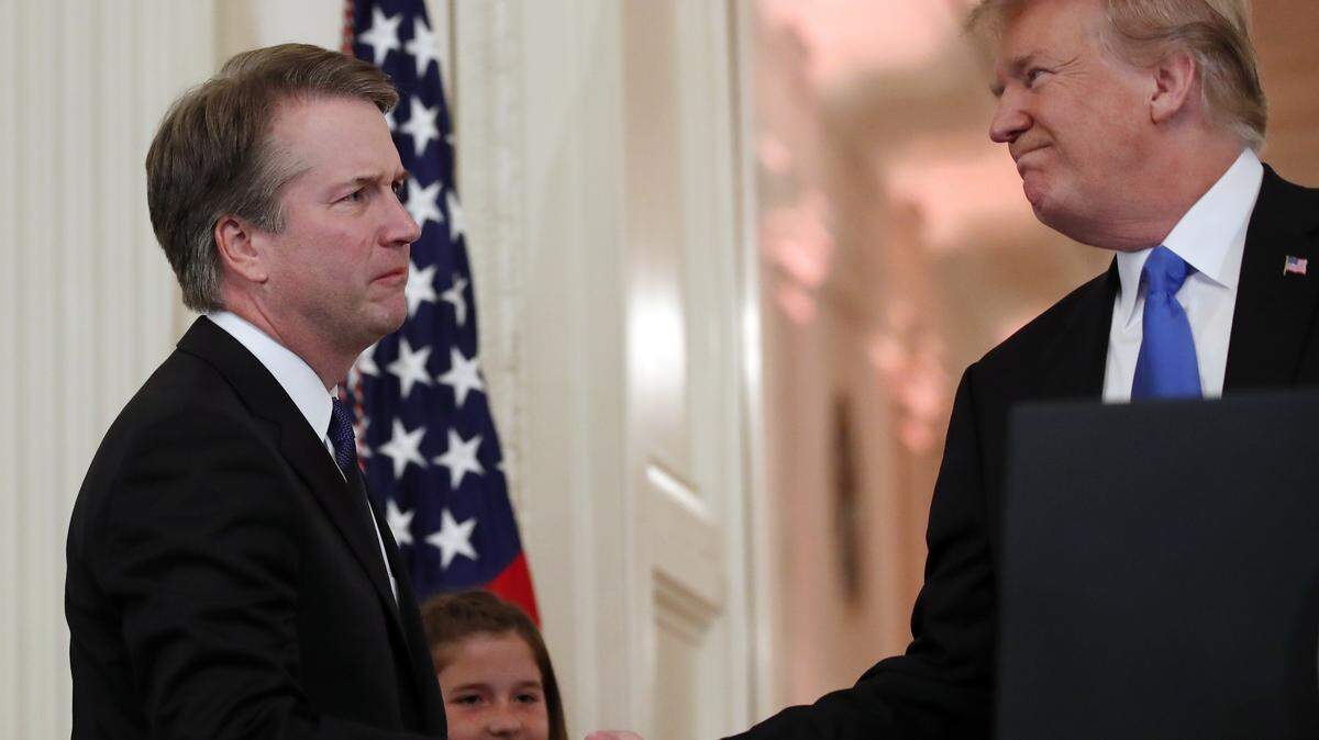 President Donald Trump shakes hands with Brett Kavanaugh on Monday, July 9, 2018. Trump announced Monday night that he was nominating Kavanaugh to the U.S. Supreme Court to replace Justice Anthony Kennedy, who is retiring.