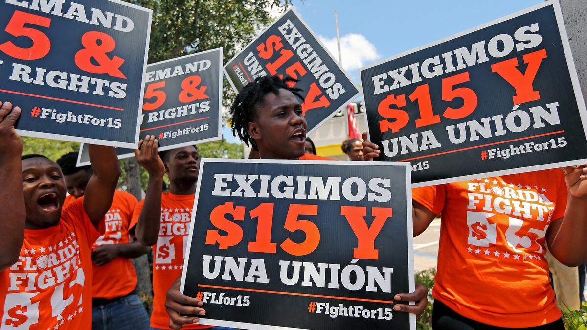 A group of people gather together in support to McDonald’s workers strike as part nationwide Fight for a $15 minimum wage movement at the McDonald’s located at 27 West Broward Blvd. Fort Lauderdale, Fla. on Thursday, May 23, 2019.