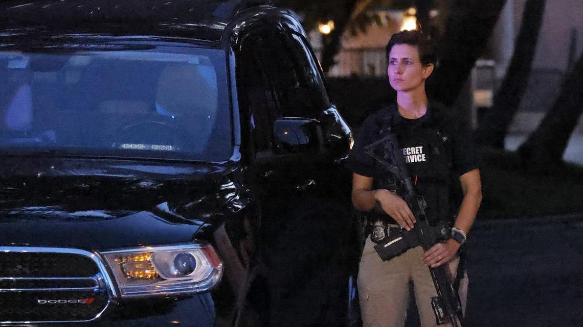 An armed Secret Service agent stands outside an entrance to former President Donald Trump’s Mar-a-Lago estate, Monday, Aug. 8, 2022, in Palm Beach, Fla. Trump said in a lengthy statement that the FBI was conducting a search of his Mar-a-Lago estate and asserted that agents had broken open a safe. (AP Photo/Terry Renna)