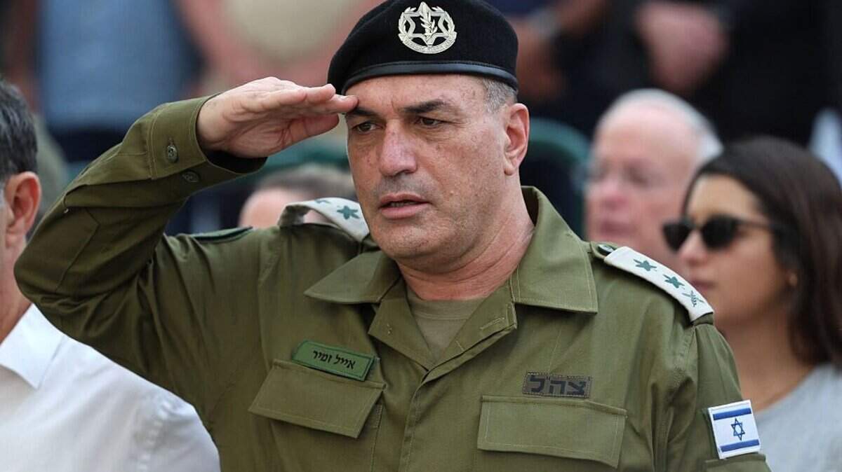 Israel's military chief Lieutenant General Eyal Zamir salutes during the funeral of Lieutenant Hadar Goldin who was killed during the six-week 2014 war in Gaza, at a military cemetery in Kfar Saba on November 11, 2025. Hundreds of Israelis gathered on November 11 in the central town of Kfar Saba to lay to rest army officer Hadar Goldin, whose remains were returned by Hamas after being held in Gaza for more than a decade. Israel received Goldin's remains as part of an ongoing Gaza ceasefire deal brokered by US President Donald Trump. (Photo by Abir SULTAN / POOL / AFP) (Photo by ABIR SULTAN/POOL/AFP via Getty Images)