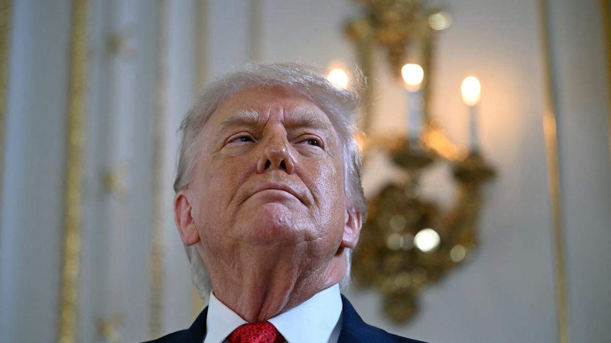 US President Donald Trump arrives to take part in a dedication ceremony for Southern Boulevard, in the ballroom at Mar-a-Lago in Palm Beach, Florida, on January 16, 2026. (Photo by ANDREW CABALLERO-REYNOLDS / AFP via Getty Images)