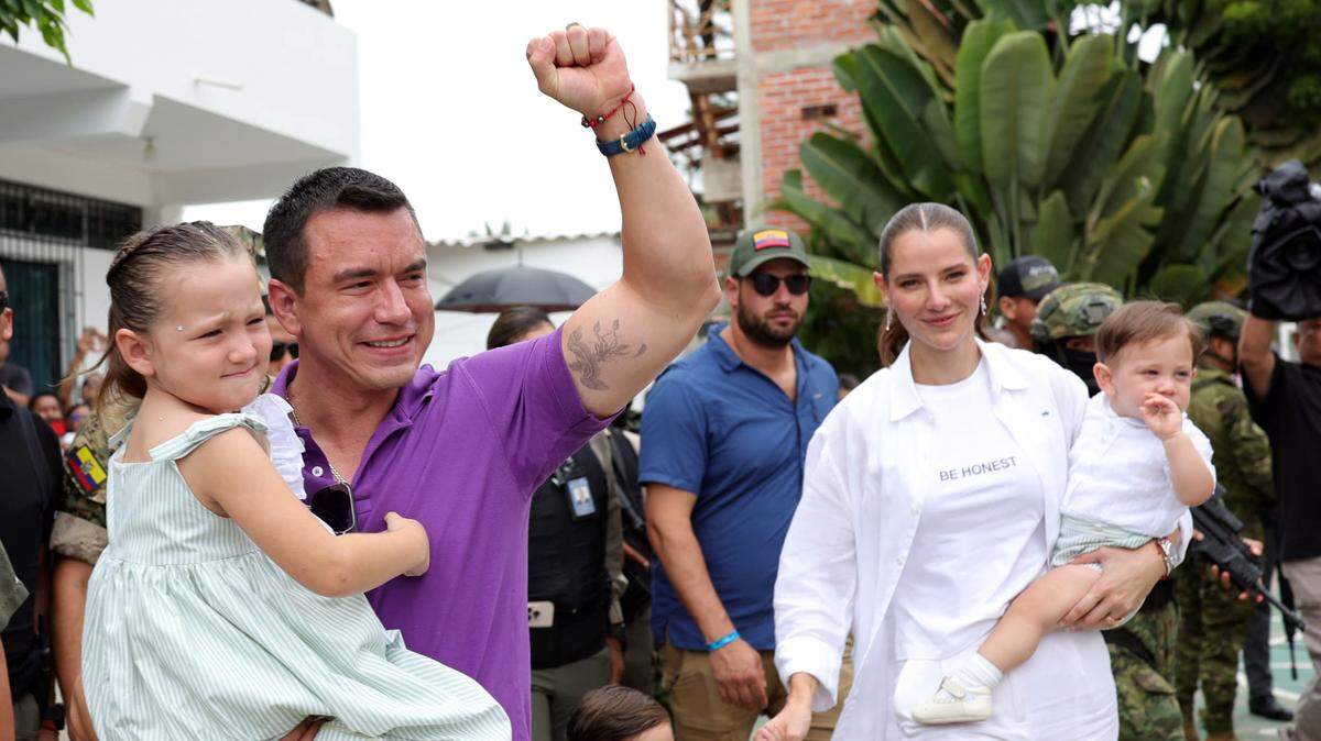 Daniel Noboa (second from left), acting president and candidate of the National Democratic Action party, greets supporters after voting at a polling station in Olón, Santa Elena, Ecuador, April 13, 2025.
