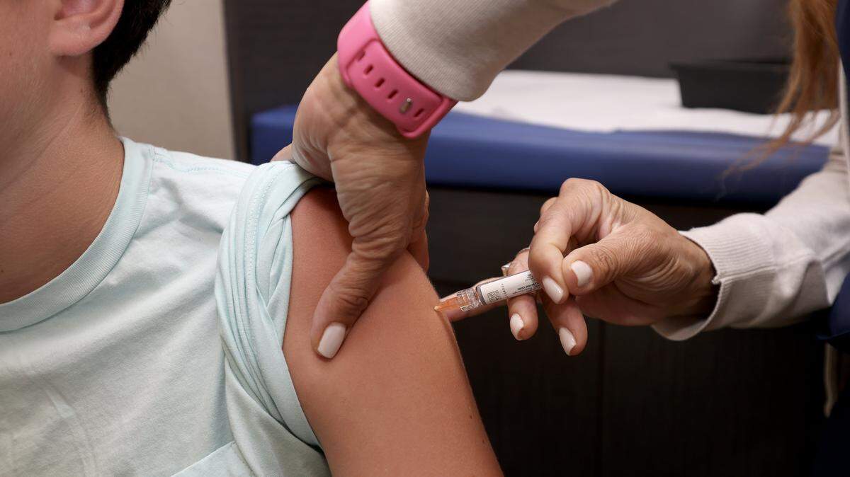 CORAL GABLES, FLORIDA - SEPTEMBER 15: A child receives a standard immunization at Doctor Gary M. Kramer, MD, PA's Pediatric office on September 15, 2025, in Coral Gables, Florida. The Florida Department of Health recently released information on the development of rulemaking to revise immunization and document requirements for school entry. (Photo by Joe Raedle/Getty Images)