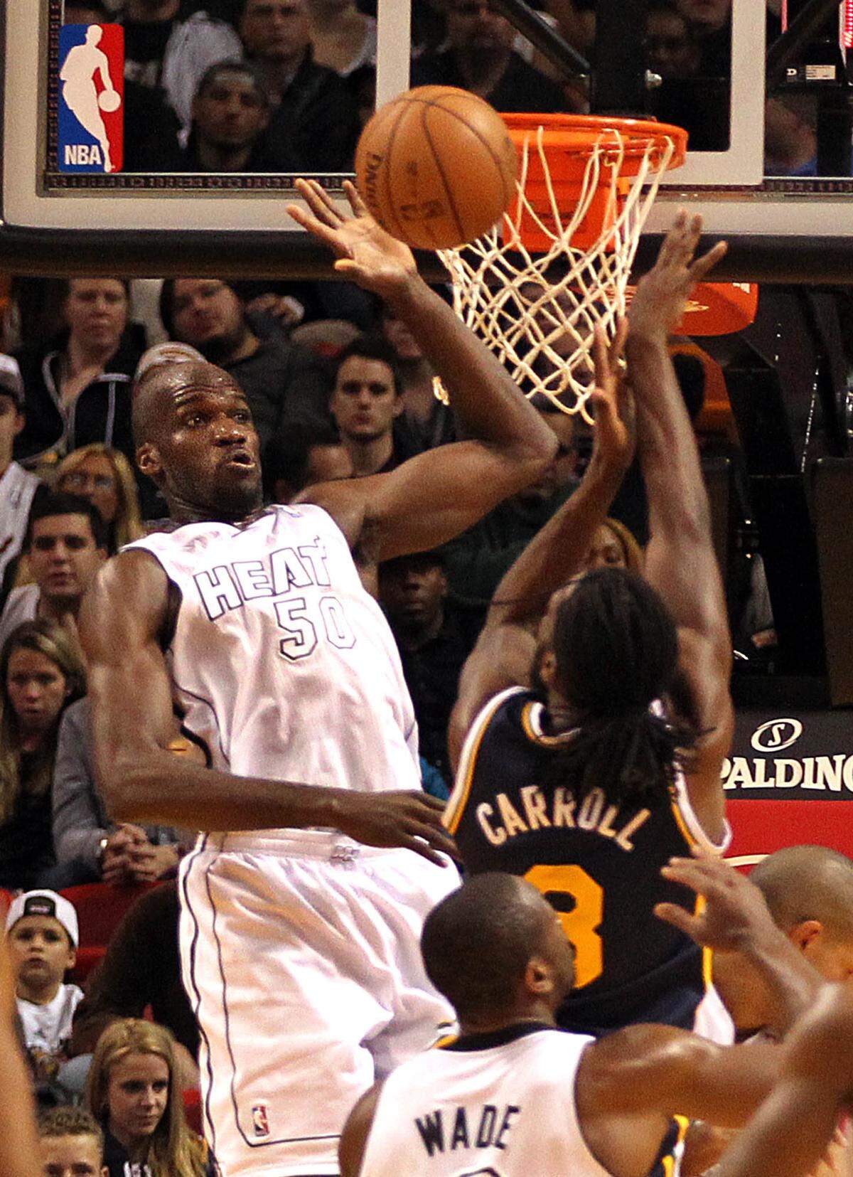 Miami Heat center Joel Anthony defends against the Utah Jazz’s DeMarre Carroll # 3, during the second quarter of the Miami Heat vs Utah Jazz, NBA game at the AmericanAirlines Arena in Miami on Saturday, December 22, 2012.