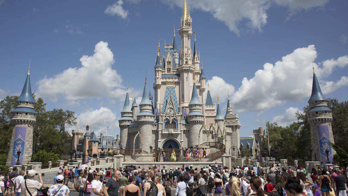 Tourists pack the area around Cinderella’s Castle at Disney’s Magic Kingdom theme park in Orlando in September 2017.