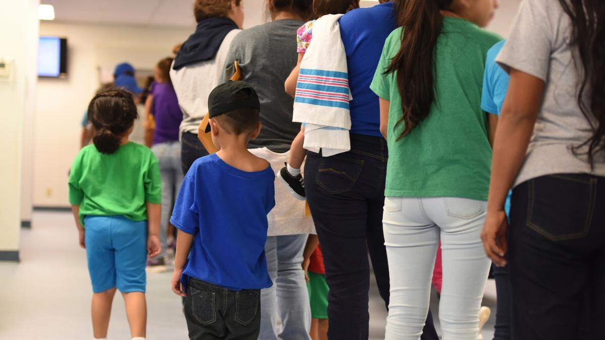 Mothers and their children wait in line at an immigration checkpoint in south Texas in August 2018. 