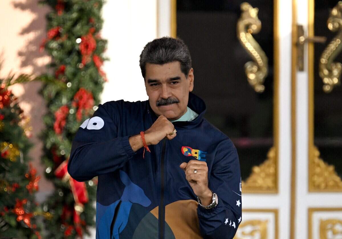 Venezuela's President Nicolas Maduro dances during the student day celebrations at Miraflores palace in Caracas, November 21, 2025. (Photo by Juan BARRETO / AFP via Getty Images)