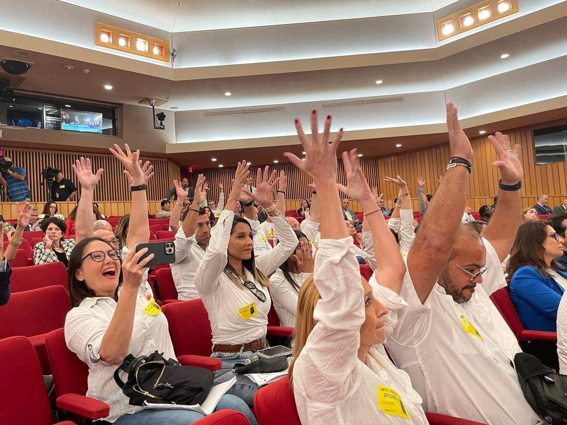 At a County Commission meeting in March 2023, Doral residents raise their hands to oppose Miami-Dade County rebuilding an incinerator in their city.