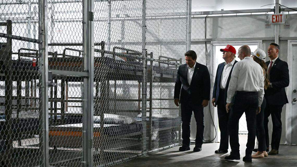 President Donald Trump (2nd from L) with Florida Gov. Ron DeSantis tour the migrant detention center, dubbed “Alligator Alcatraz,” on July 1, 2025.