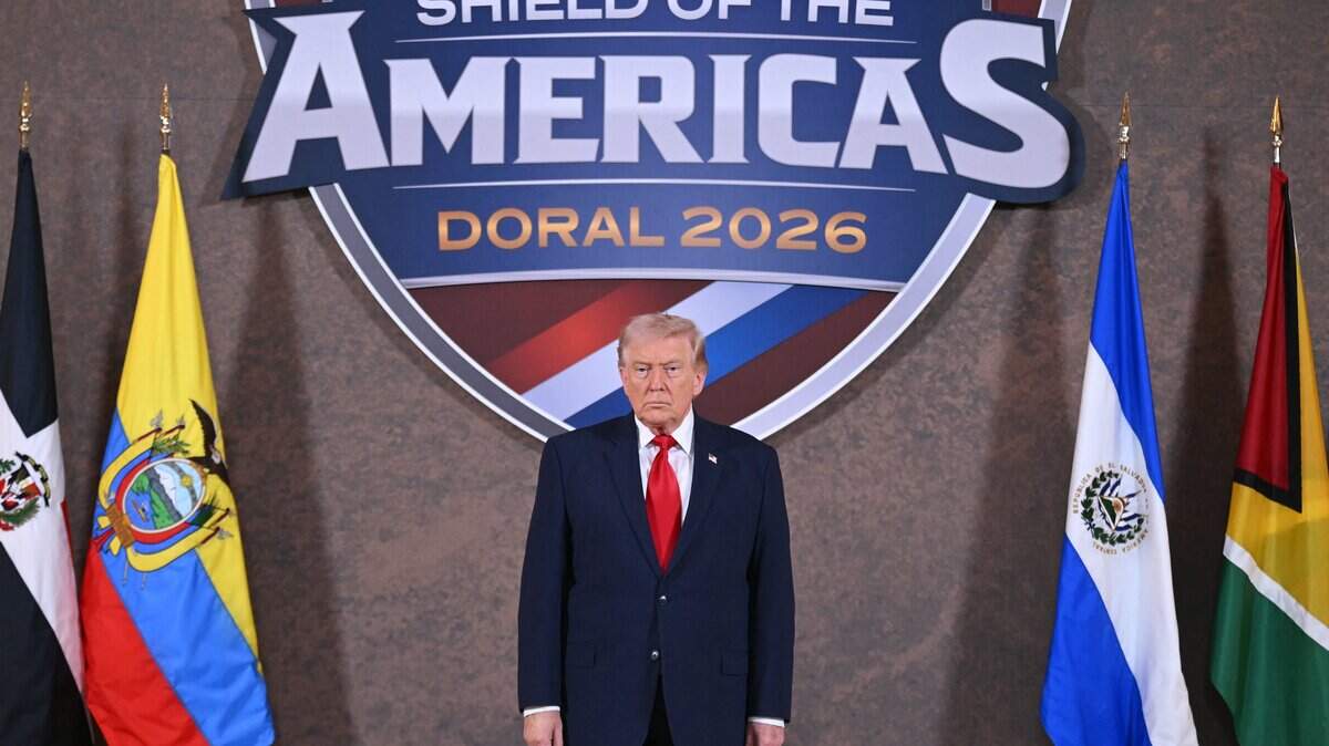 US President Donald Trump poses for a photo at the start of the "Shield of the Americas" Summit at Trump National Doral in Miami, Florida, March 7, 2026. President Trump is hosting a dozen right-wing leaders from Latin America and the Caribbean to discuss issues facing the region, from organized crime to illegal immigration. The summit also aims to serve Washington by boosting US interests in the region and curbing those from foreign powers like China. (Photo by SAUL LOEB / AFP via Getty Images)