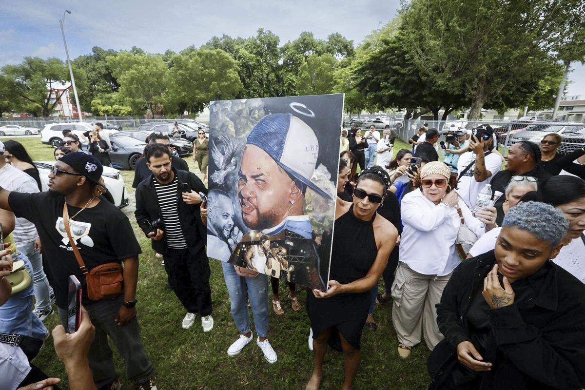 Fans gather in Hialeah after the October death of Cuban reggaeton star El Taiger, whose real name is Jose Manuel Carvajal Zaldivar. The man suspected of shooting him was charged with first-degree murder by a grand jury this week. The state is weighing seeking the death penalty.