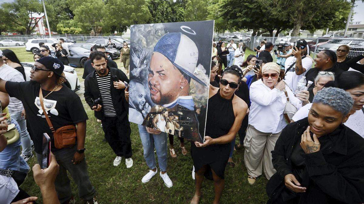 Fans gather in Hialeah after the October death of Cuban reggaeton star El Taiger, whose real name is Jose Manuel Carvajal Zaldivar. The man suspected of shooting him was charged with first-degree murder by a grand jury this week. The state is weighing seeking the death penalty.