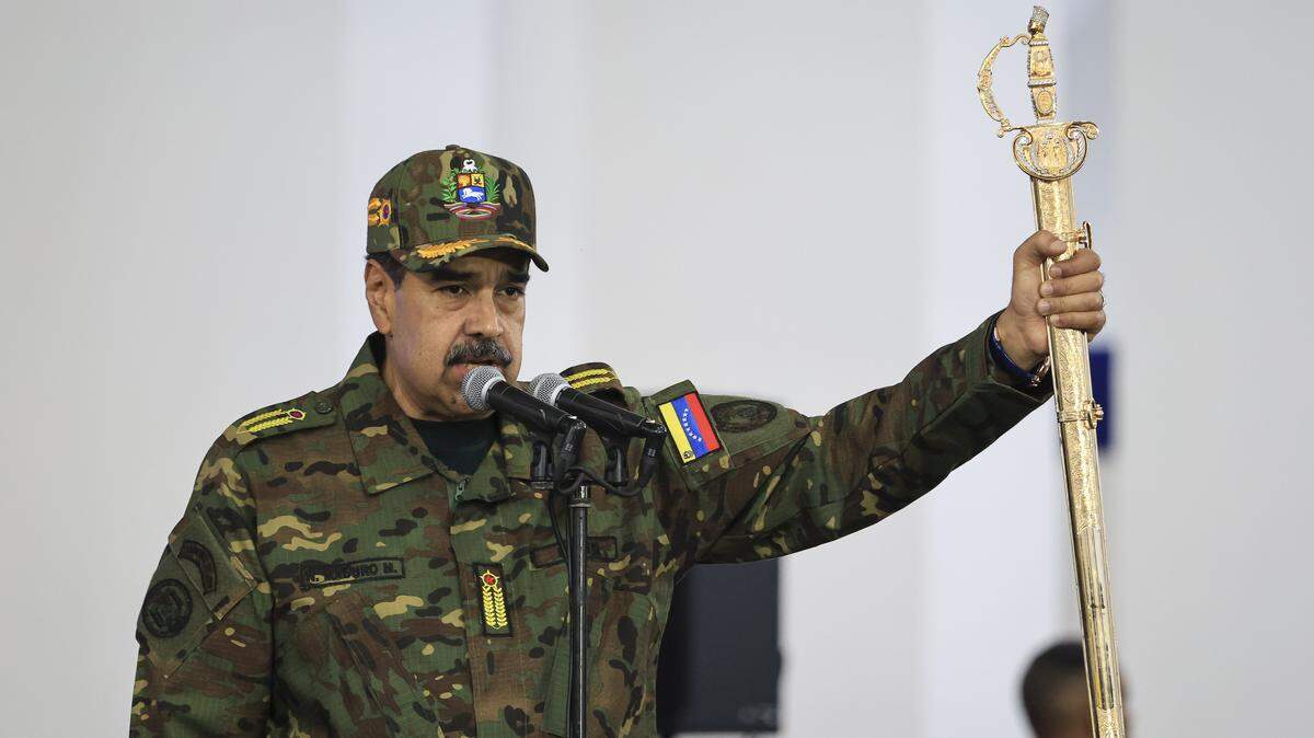 CARACAS, VENEZUELA - NOVEMBER 25: President of Venezuela NicolÃ(degrees)s Maduro delivers a speech while holding the Venezuelan independence hero Simon Bolivar's 'Sword of Peru' during a military ceremony on November 25, 2025, in Caracas, Venezuela. The United States recently designated the "Cartel De Los Soles" (Cartel of The Suns) as a foreign terrorist organization, a group allegedly led by the president of Venezuela, Nicolas Maduro, and which, it is presumed, includes high-ranking members of the Venezuelan government. (Photo by Jesus Vargas/Getty Images)